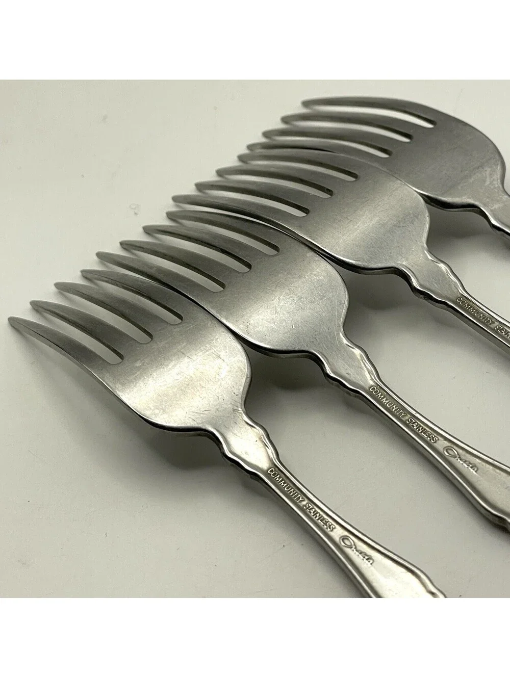 4- Oneida Community FANTASY Burnished Stainless Pierced Hndl Dinner Fork ~7.25”